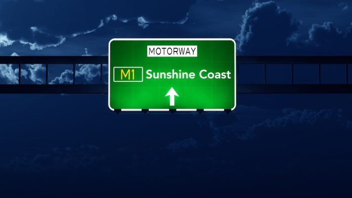 Sunshine Coast Australia Highway Road Sign at Night